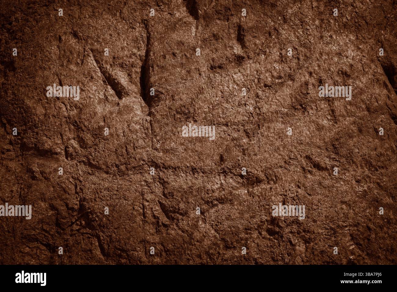 Brown rocky surface texture. Brown natural stone mountain background. Stock Photo