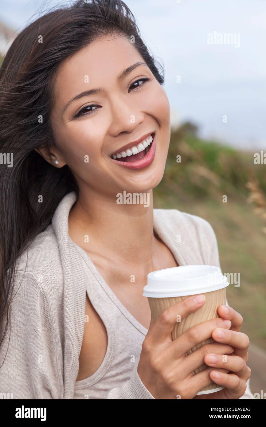 Outdoor portrait of a beautiful young Chinese Asian young woman or girl ...
