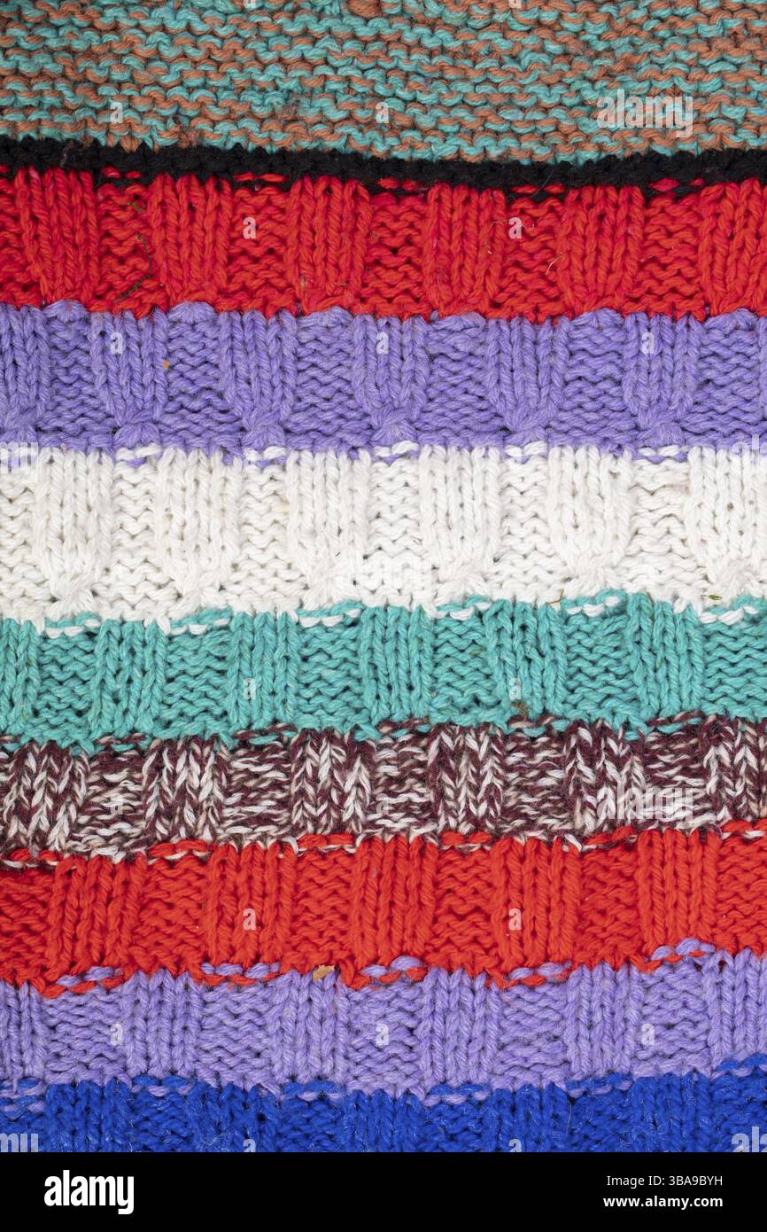 Knitted multicoloured texture. Background knitted stripes close-up Stock Photo