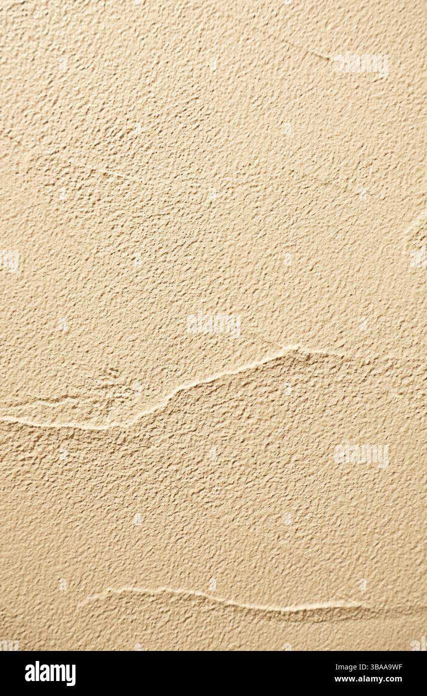 Front View of Light Beige Colored Grunge Concrete Wall Stock Photo