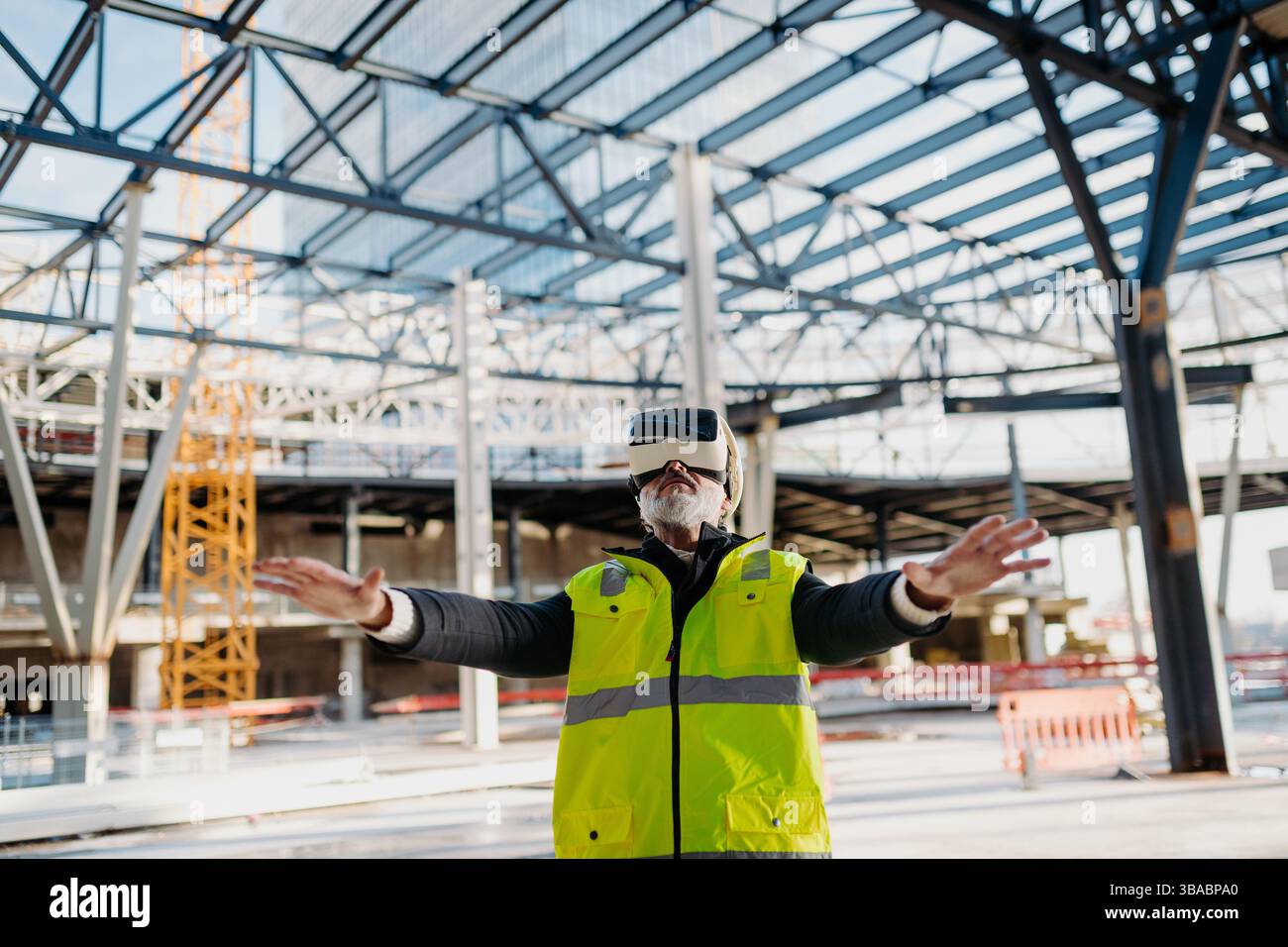 Engineer using virtual reality to inspect building progress. Stock Photo