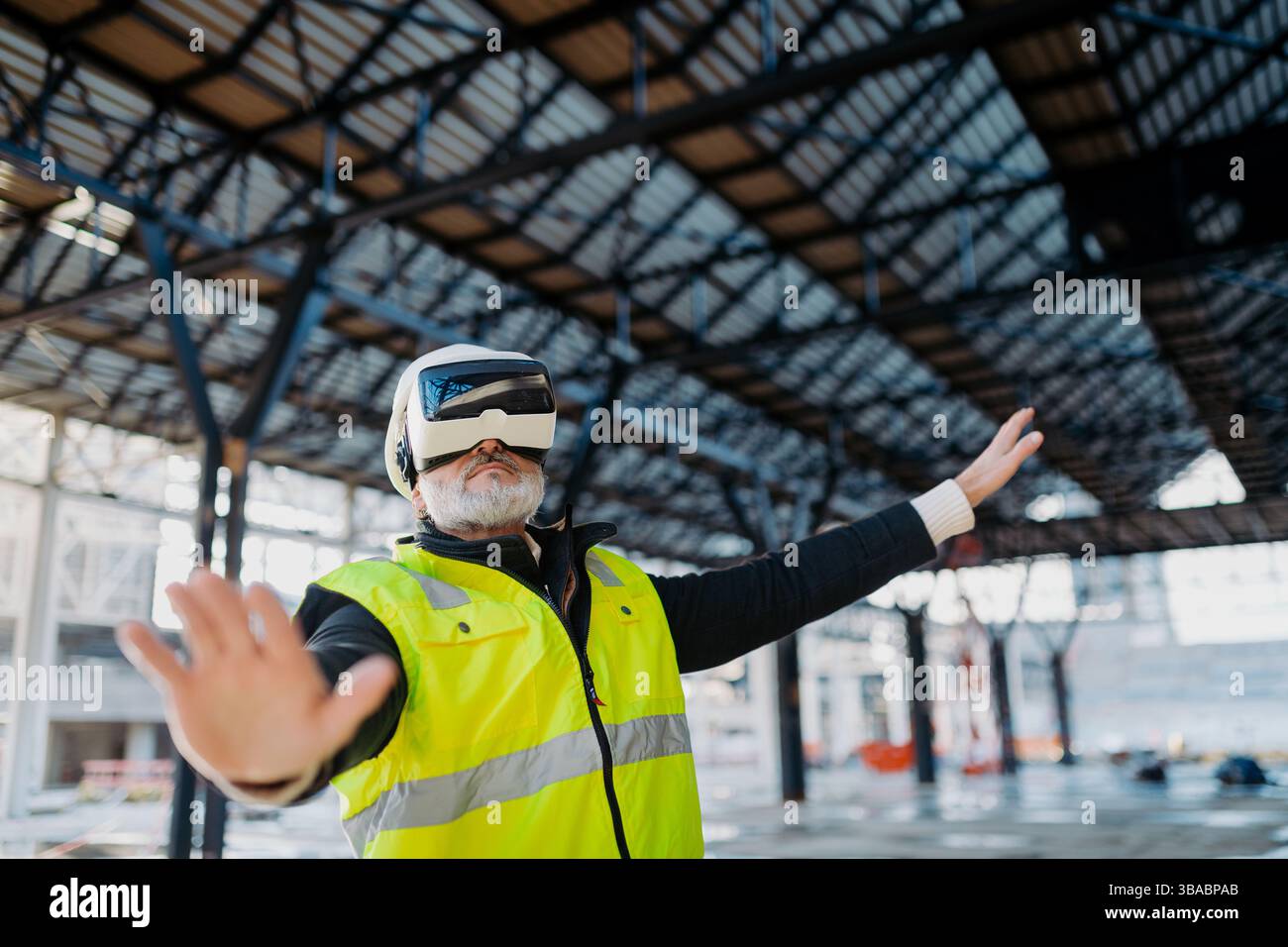 Engineer using virtual reality to inspect building progress. Stock Photo