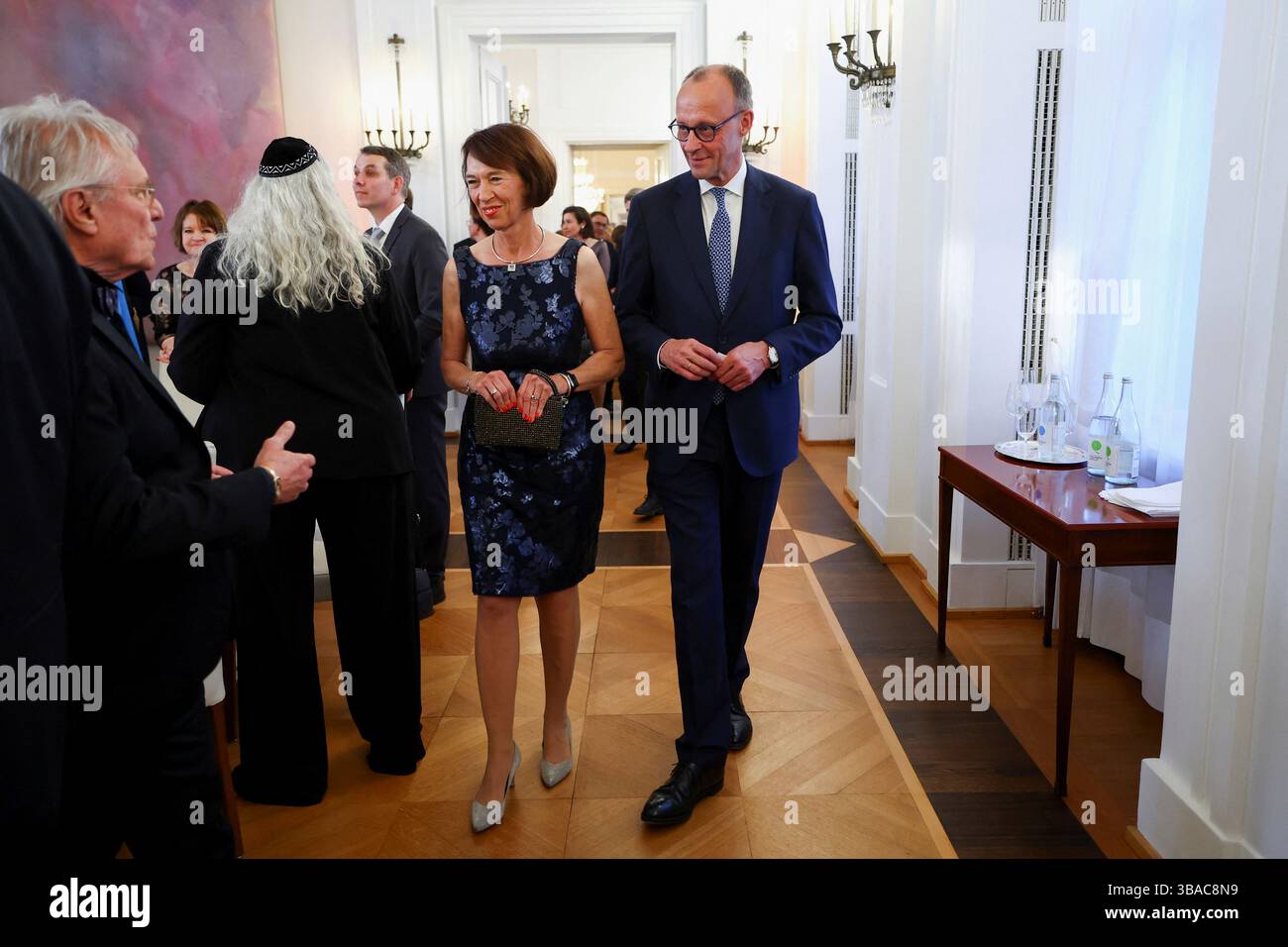 German Chancellor Friedrich Merz, right, and his wife Charlotte Merz ...