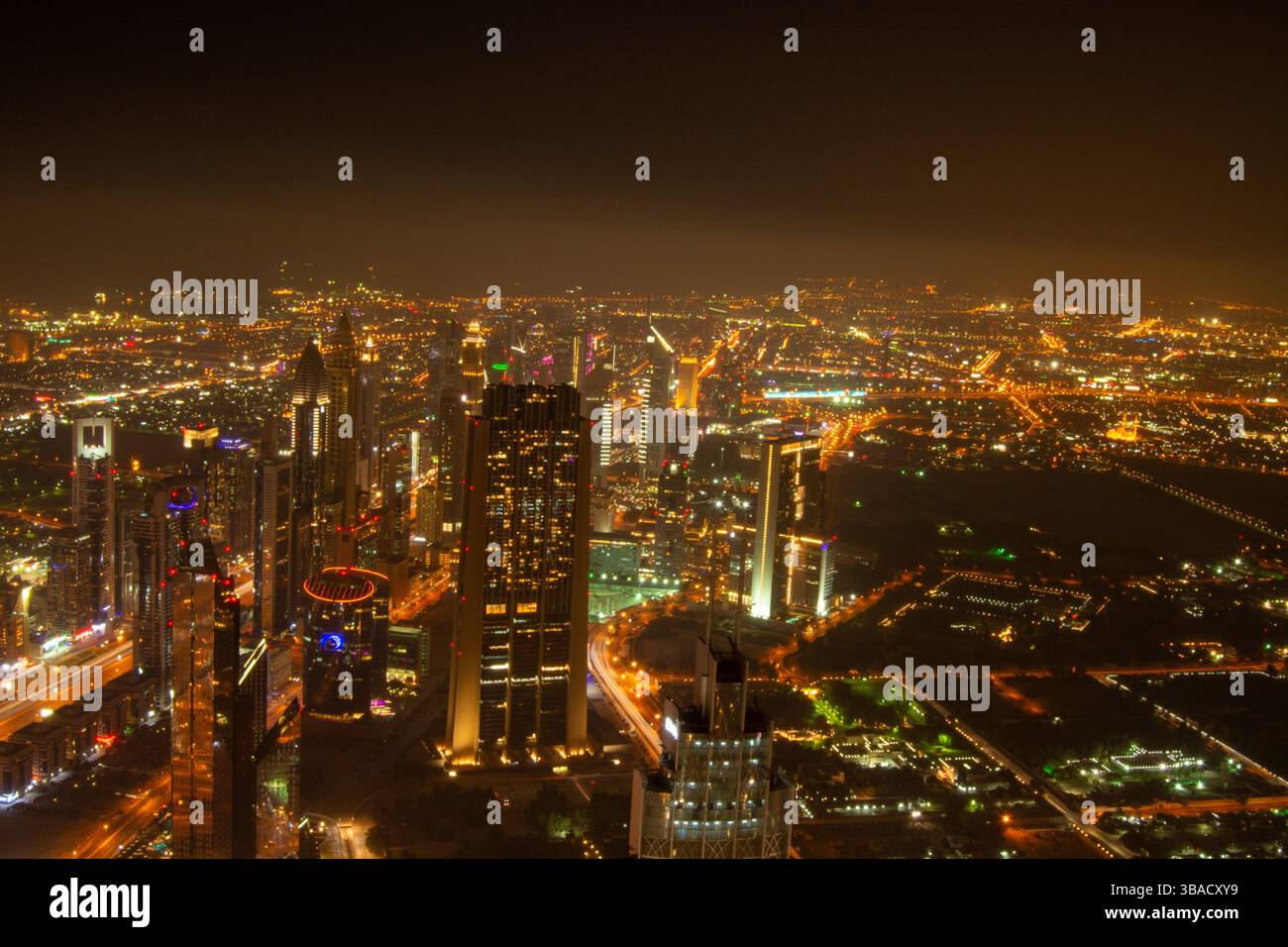 A stunning aerial view of a vibrant city skyline at night, showcasing ...