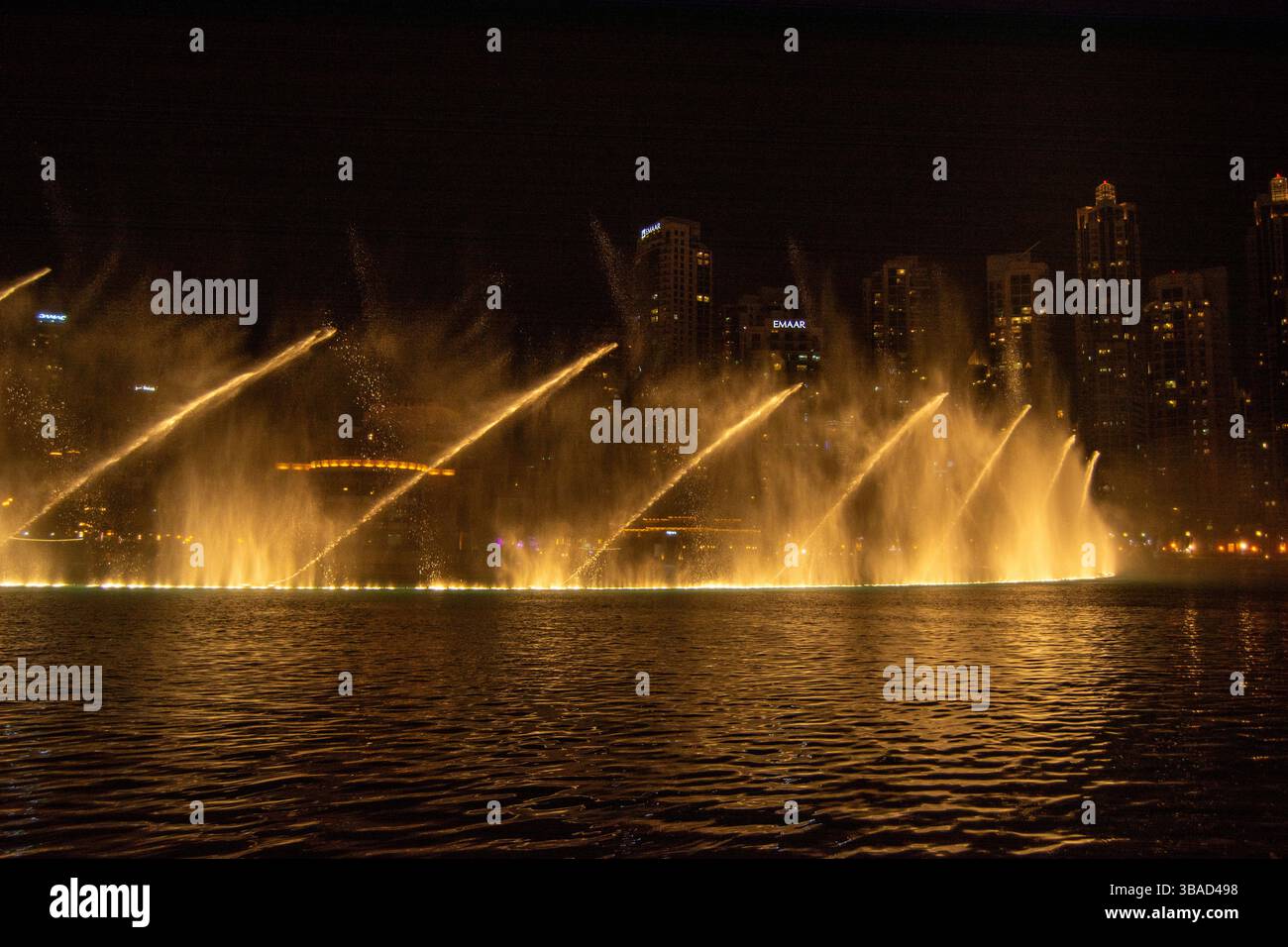 A stunning night view of a fountain show with illuminated water jets ...