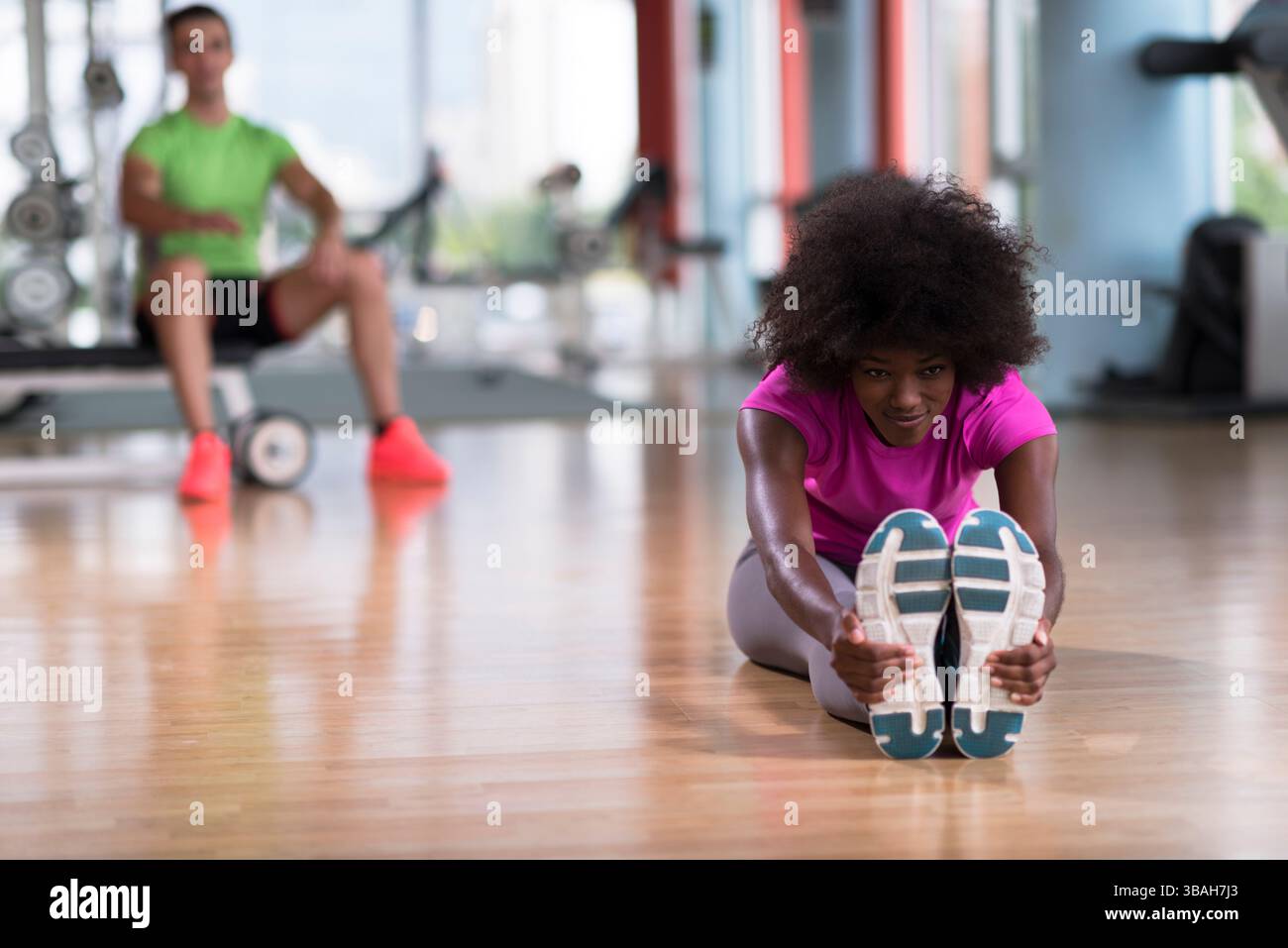 African American Woman With Curly Afro Doing Stretching Exercise African American Woman With Curly Afro Doing Stretching Exercise