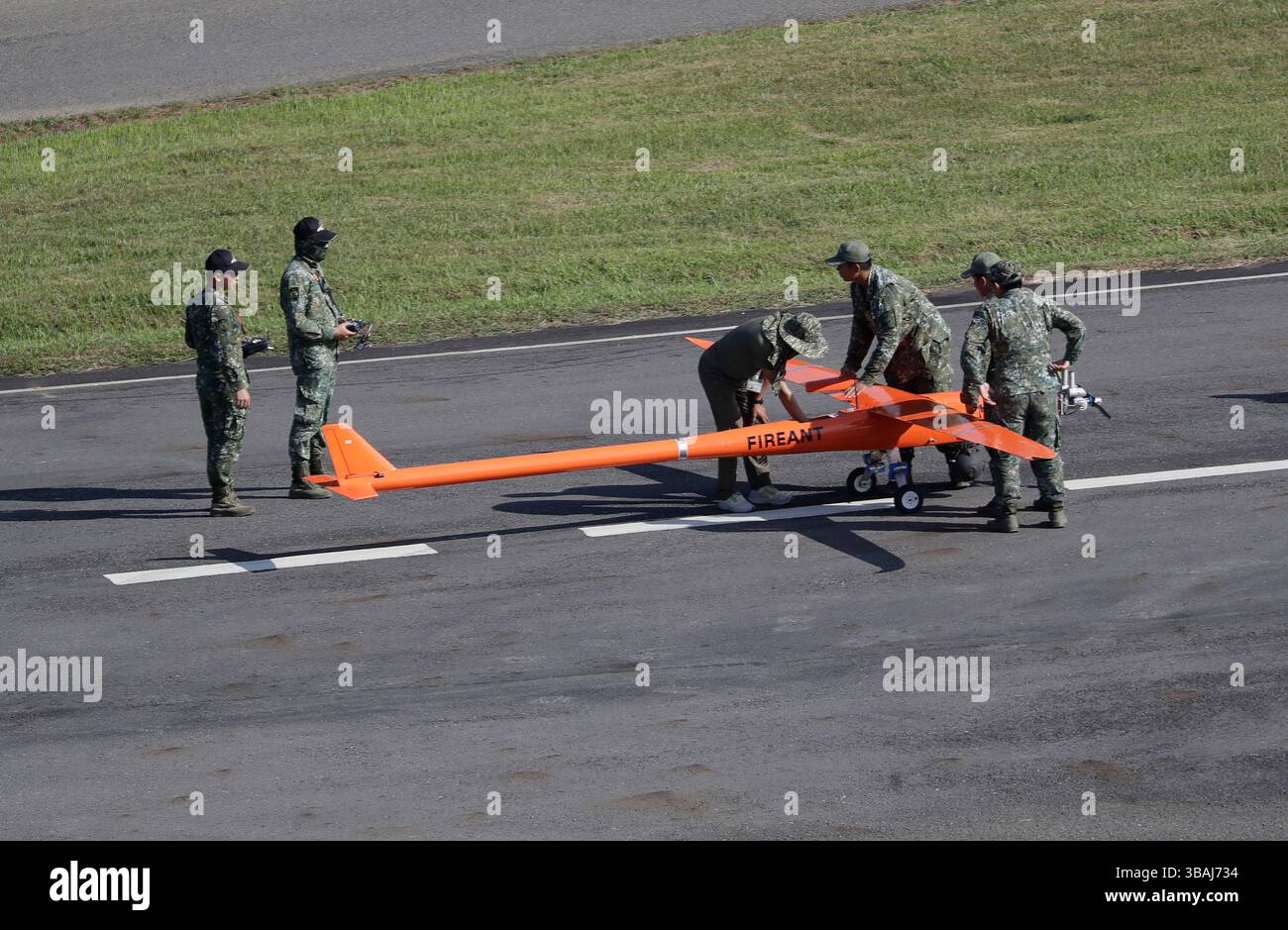 Military and technical personnel check a target machine during a ...