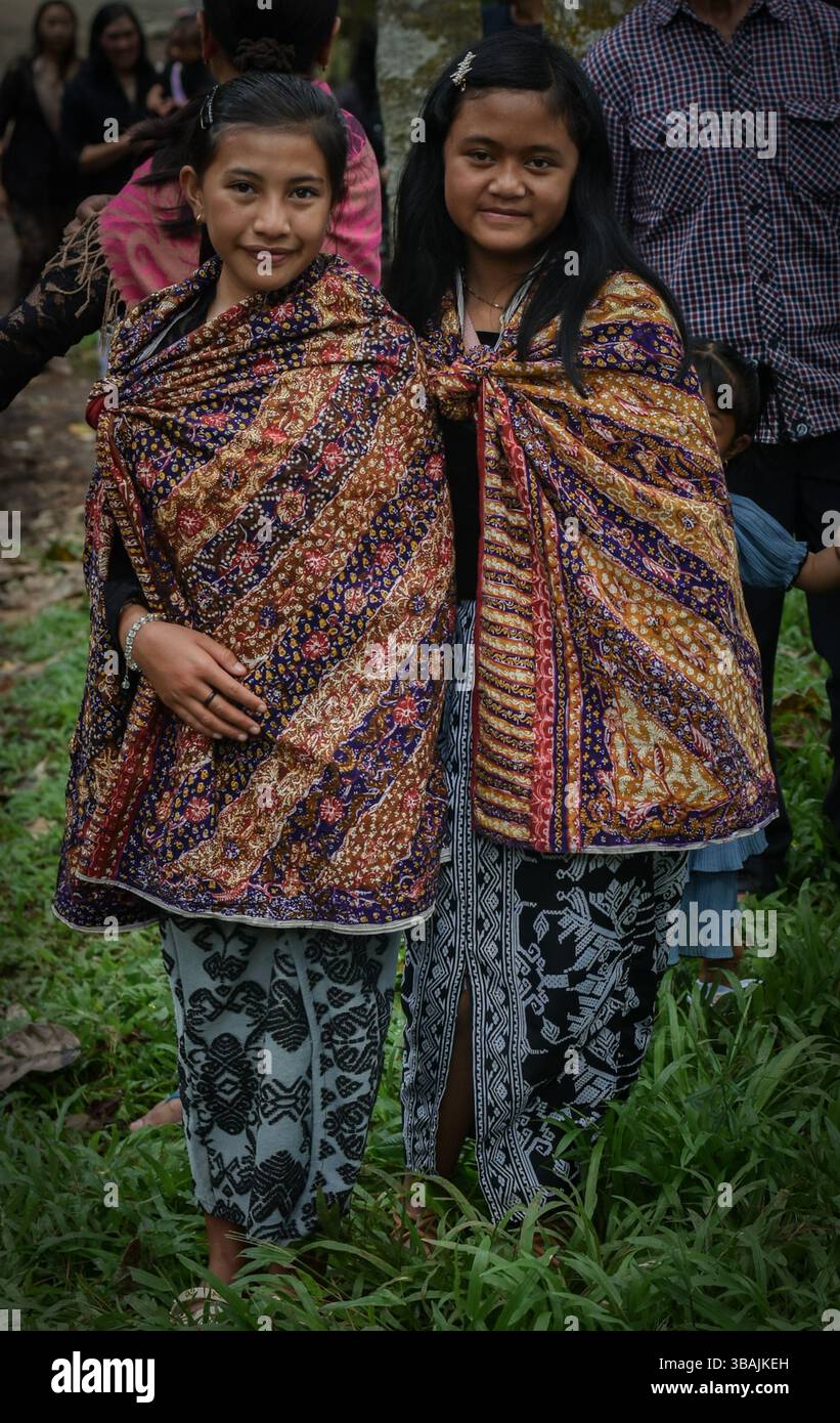 Malang, East Java, Indonesia. 12th May, 2025. two young girls using ...
