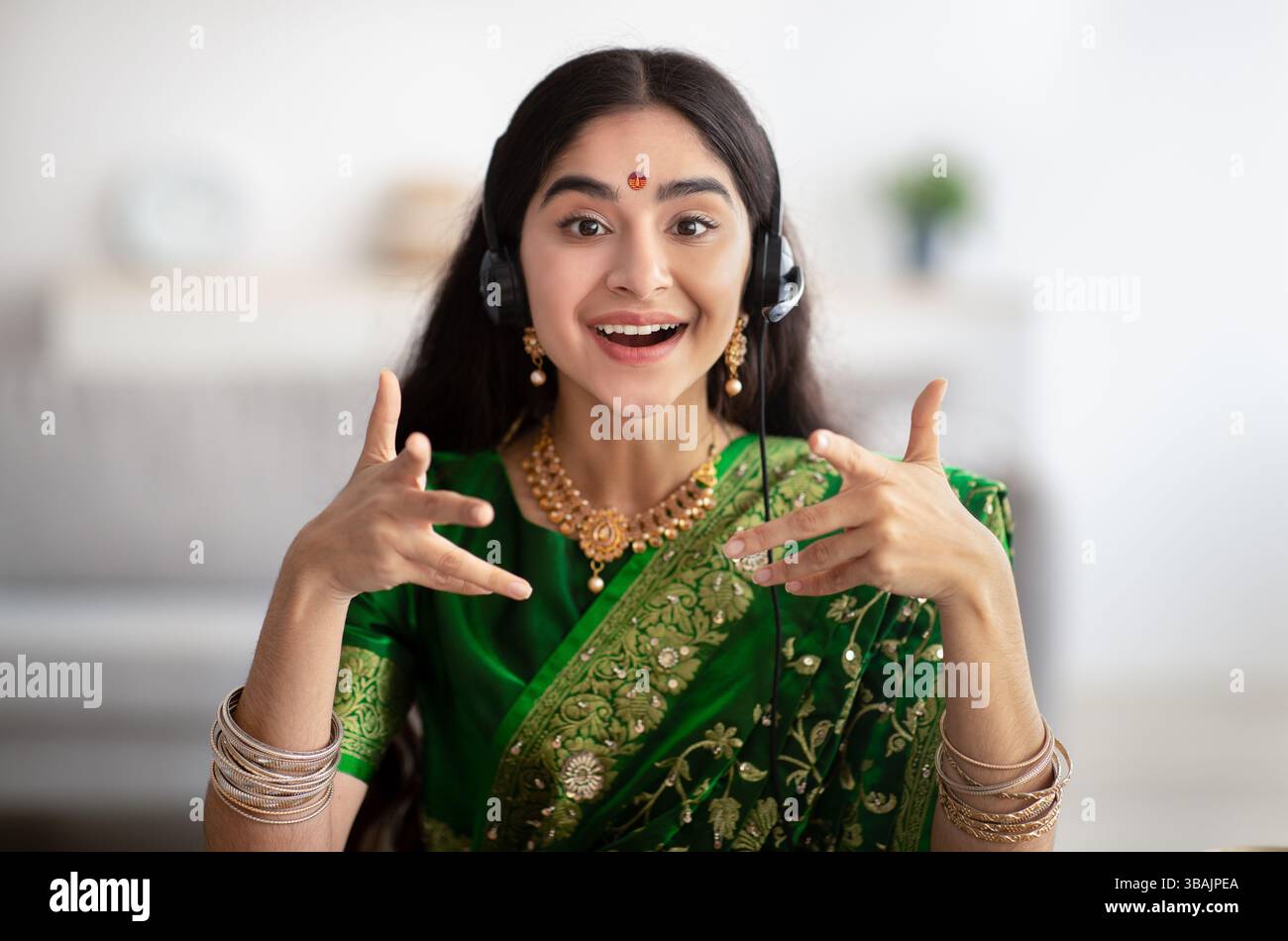 Portrait screen view of smiling young Indian woman making video call at ...