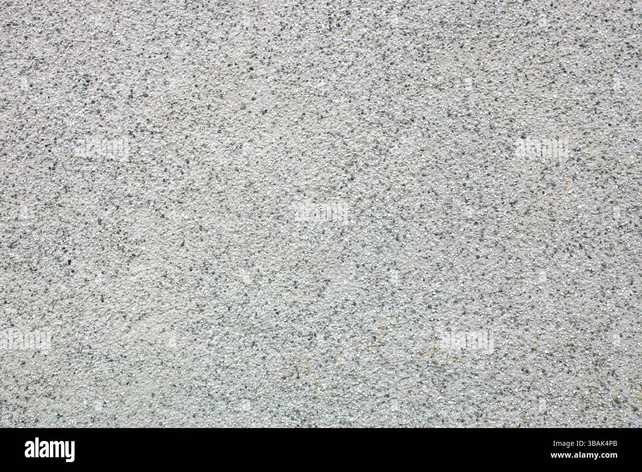 Pebble dash roughcast rendered external house wall background backdrop. External building render style concept. Stock Photo