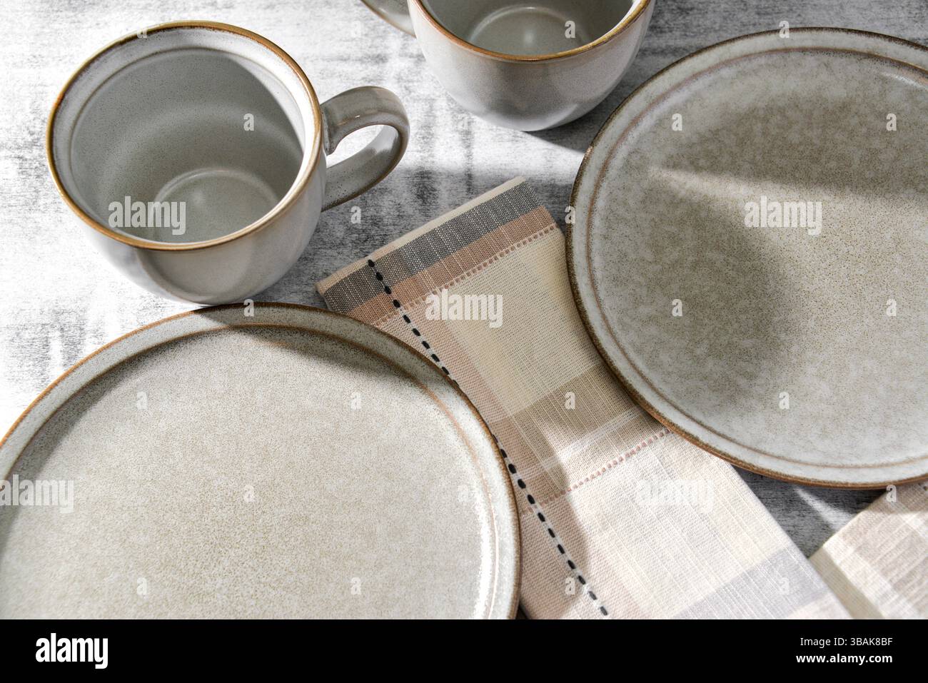 Empty plates and coffee cups on table Stock Photo