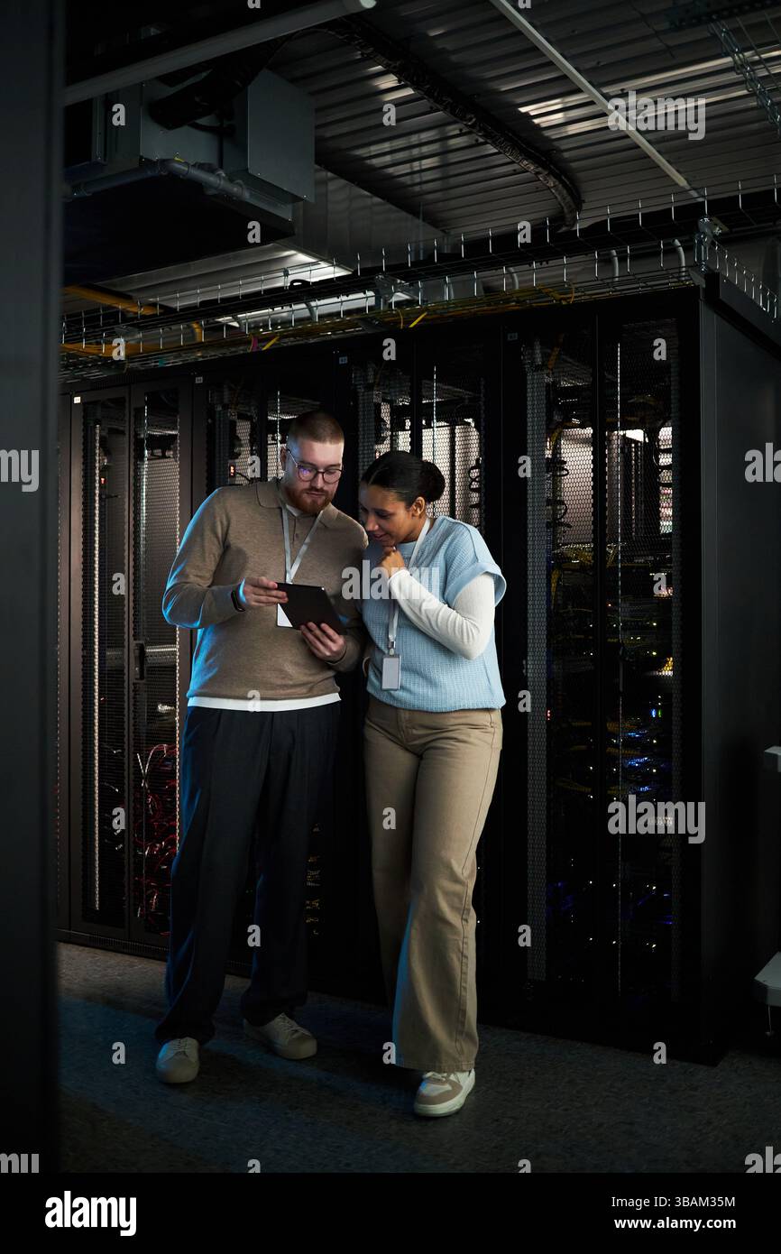 Discussing Server Maintenance in Data Center Environment Stock Photo