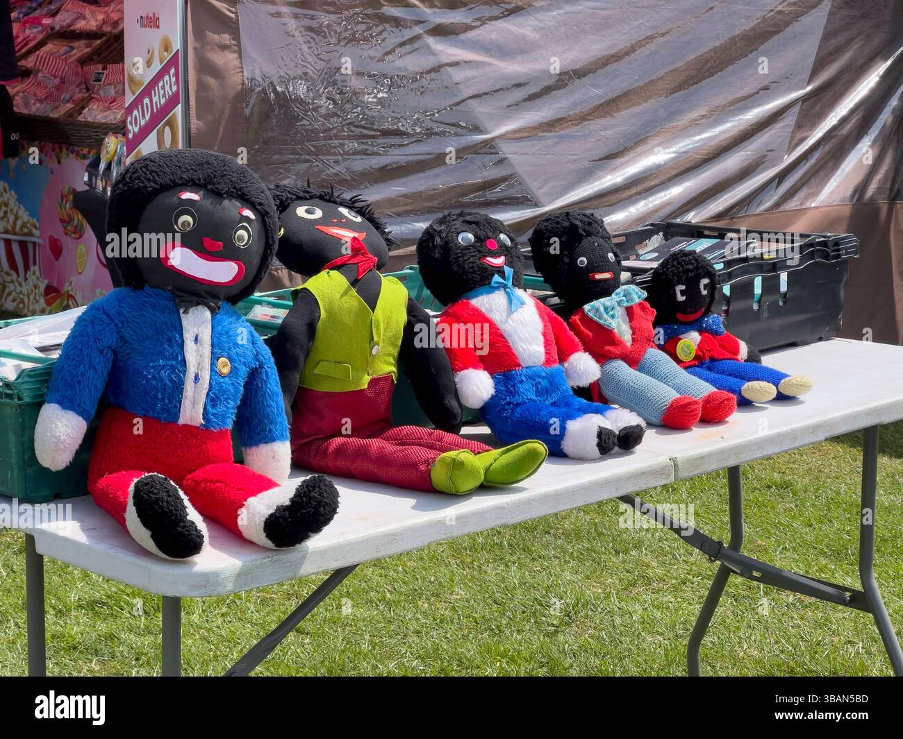 Home-made golliwog dolls on a stall at a rural car boot sale in England. These are now generally viewed as crudely racist images Stock Photo