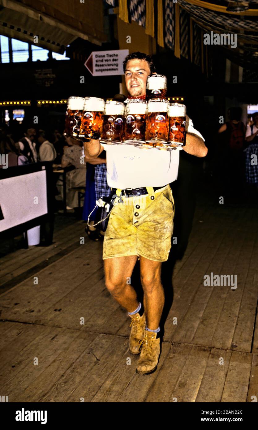 Waiter carrying beer hi-res stock photography and images - Alamy