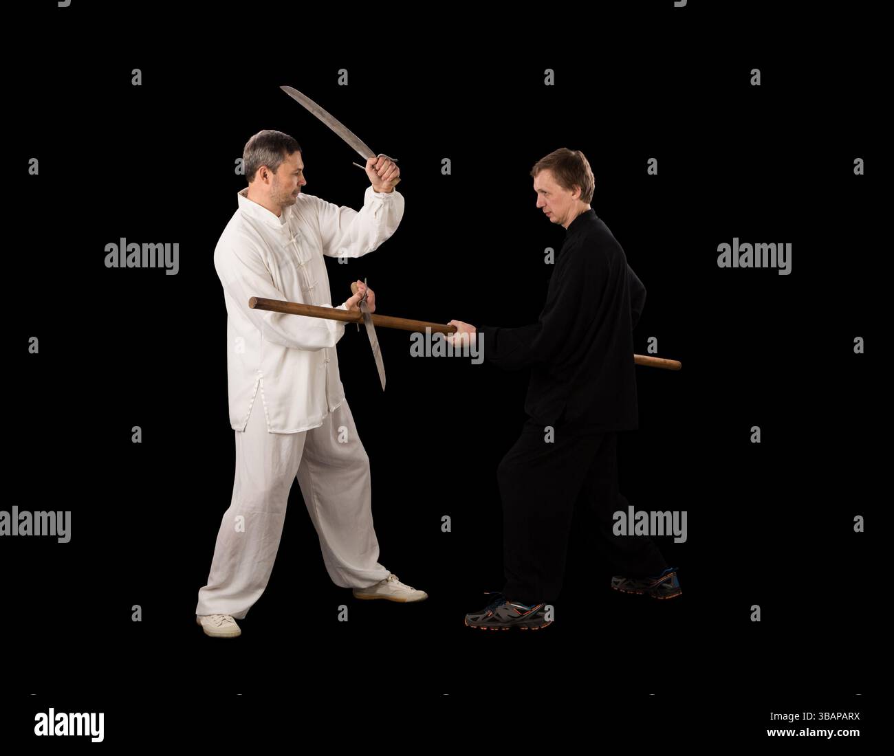 Men fighting martial arts on a black background Stock Photo - Alamy