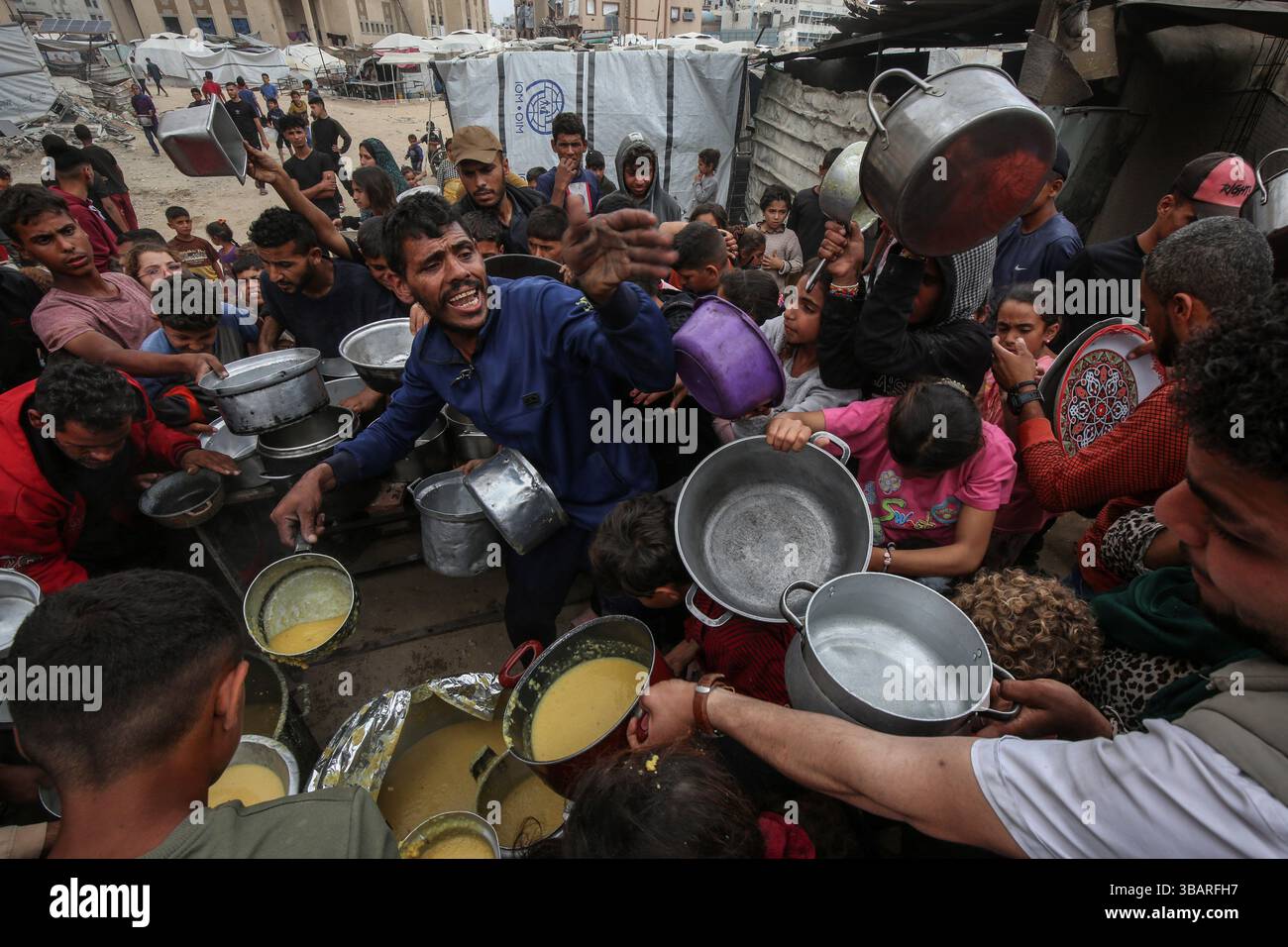 Food In Gaza Gaza. 12th May, 2025. Palestinians receive free food at a food ...