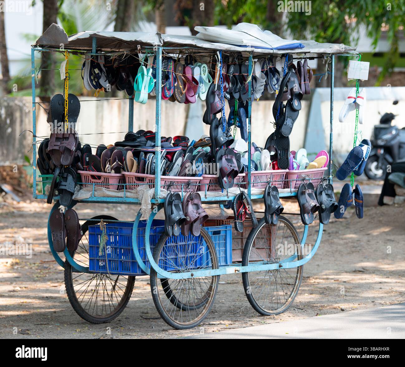 Sale of shoes at market stall hand cart on street in India, traditional ...
