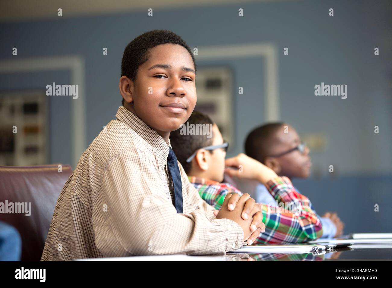 Young black boys sitting paying attention in the school classroom Stock ...