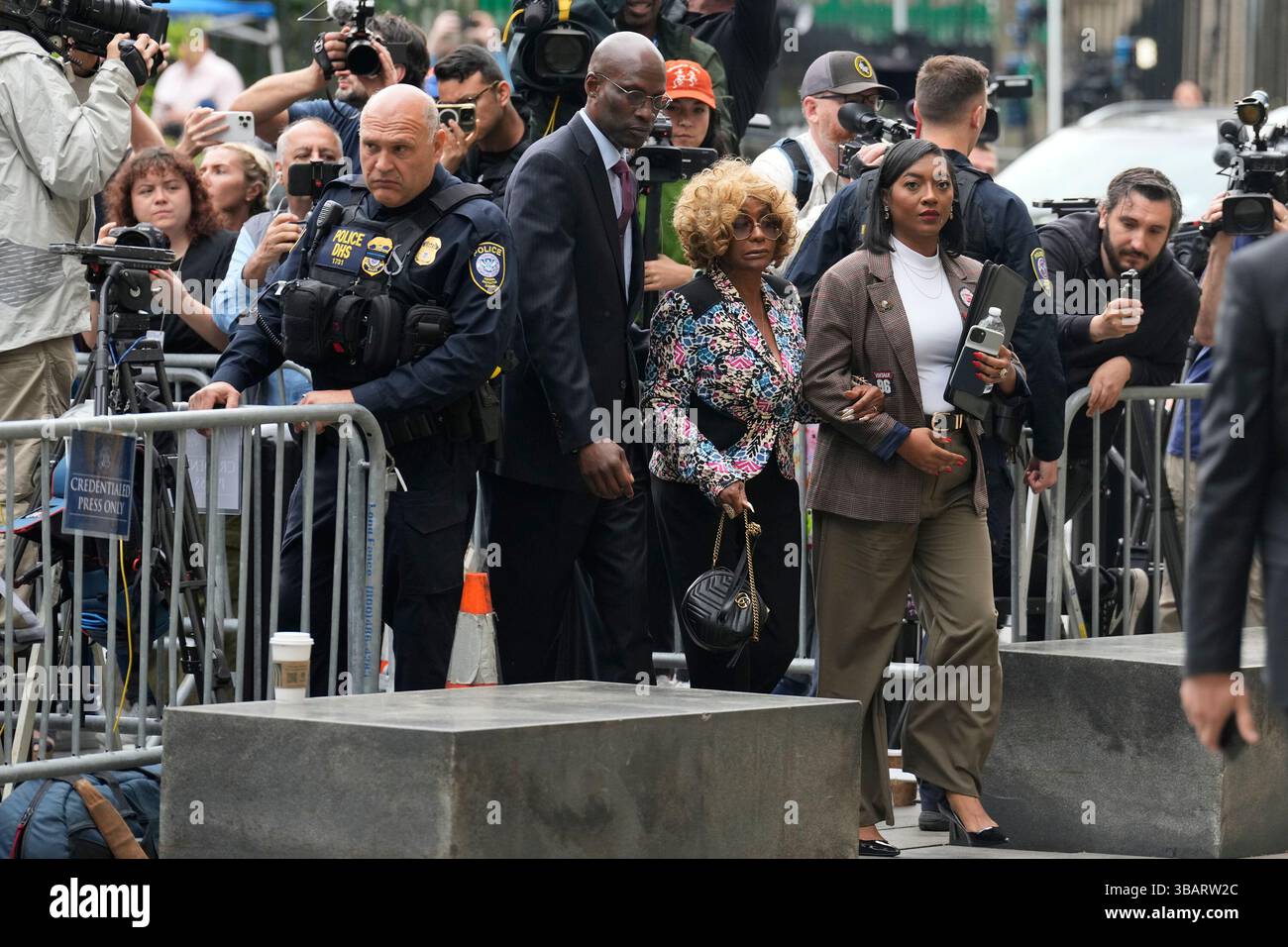 Janice Combs, mother of Sean Diddy Combs, left center, arrives at