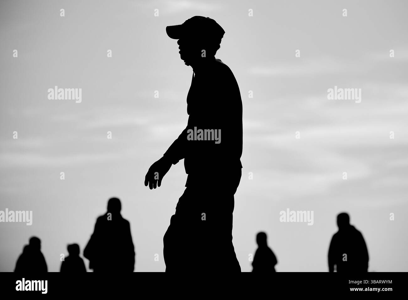 Person standing out in crowd Black and White Stock Photos & Images - Alamy