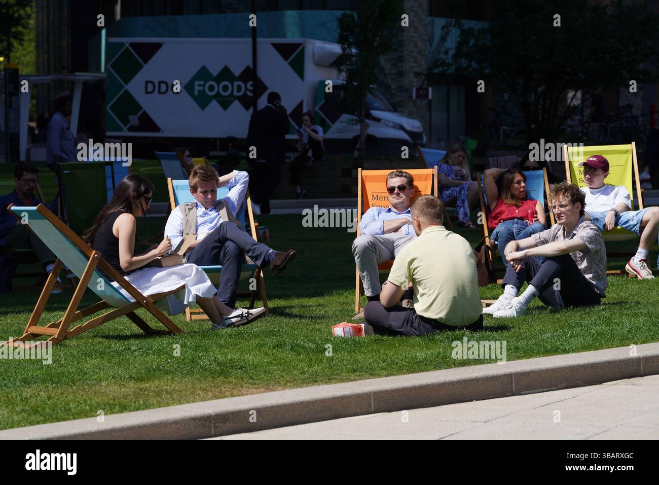 People enjoying the spring sunshine in Paddington, London. Picture date ...