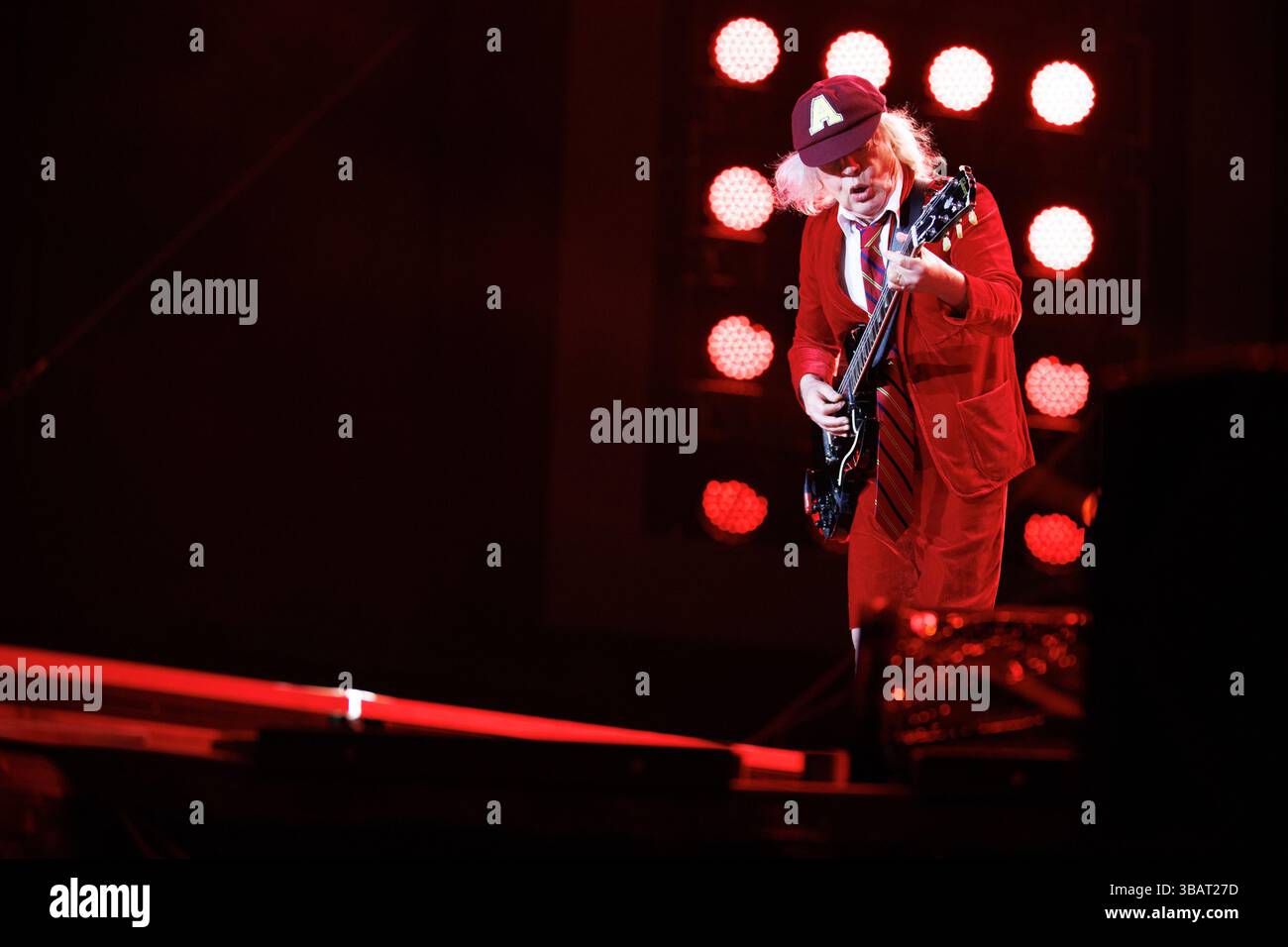 Landover, USA. 12th May, 2025. Angus Young of AC/DC performs at ...