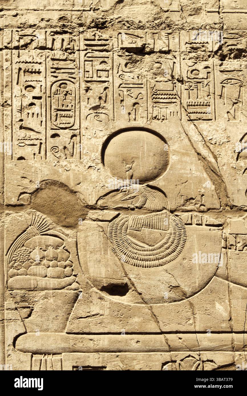 Ancient stone wall with Egyptian hieroglyphs in the Karnak Temple ...