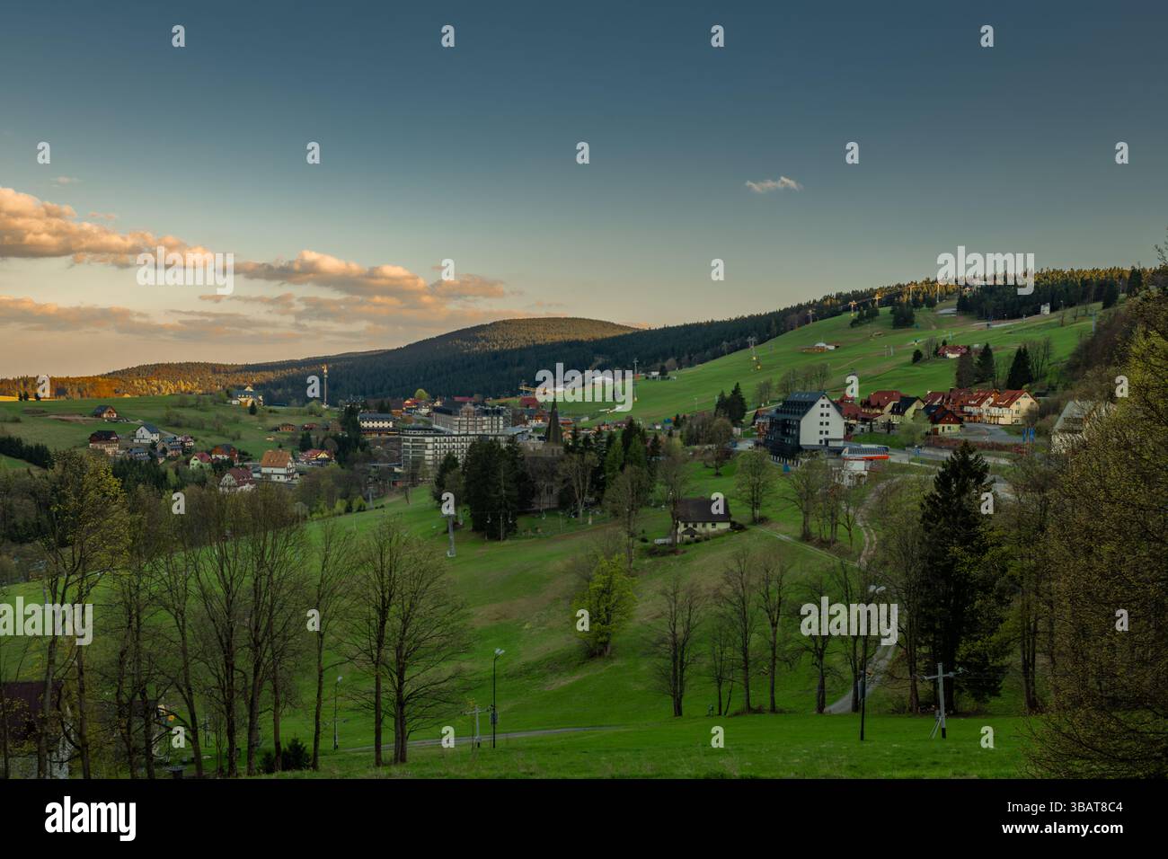 Spring fresh evening view for village with hotels and ski slopes in Zieleniec Poland 04 28 2025 Stock Photo