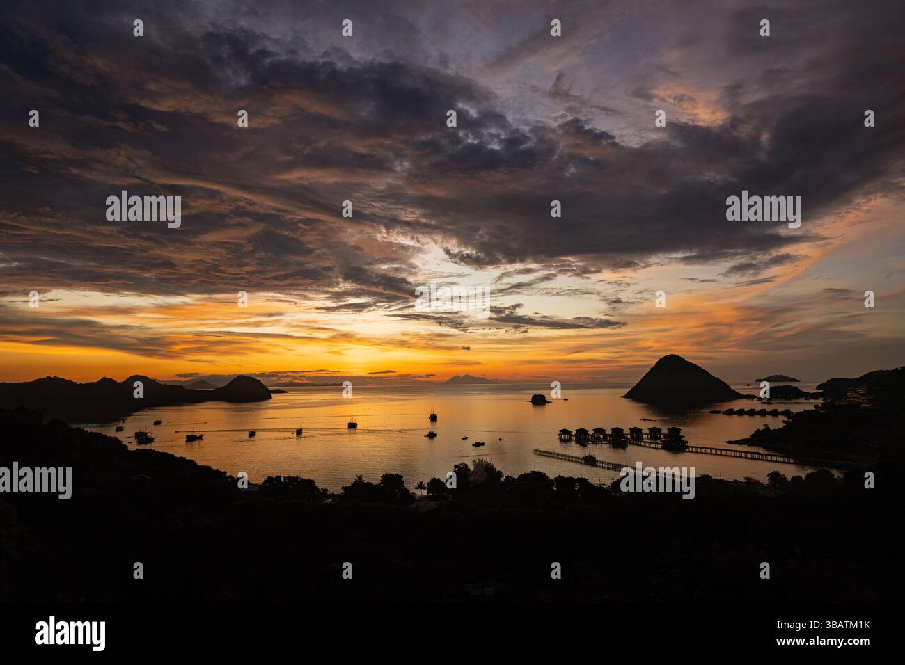 Breathtaking sunset over the harbor in Labuan Bajo Komodo Indonesia ...