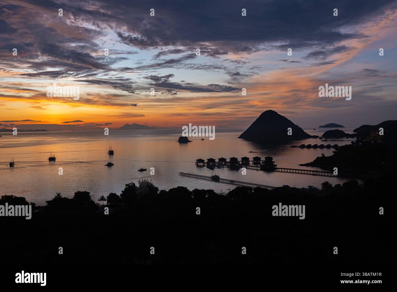 Breathtaking sunset over the harbor in Labuan Bajo Komodo Indonesia ...