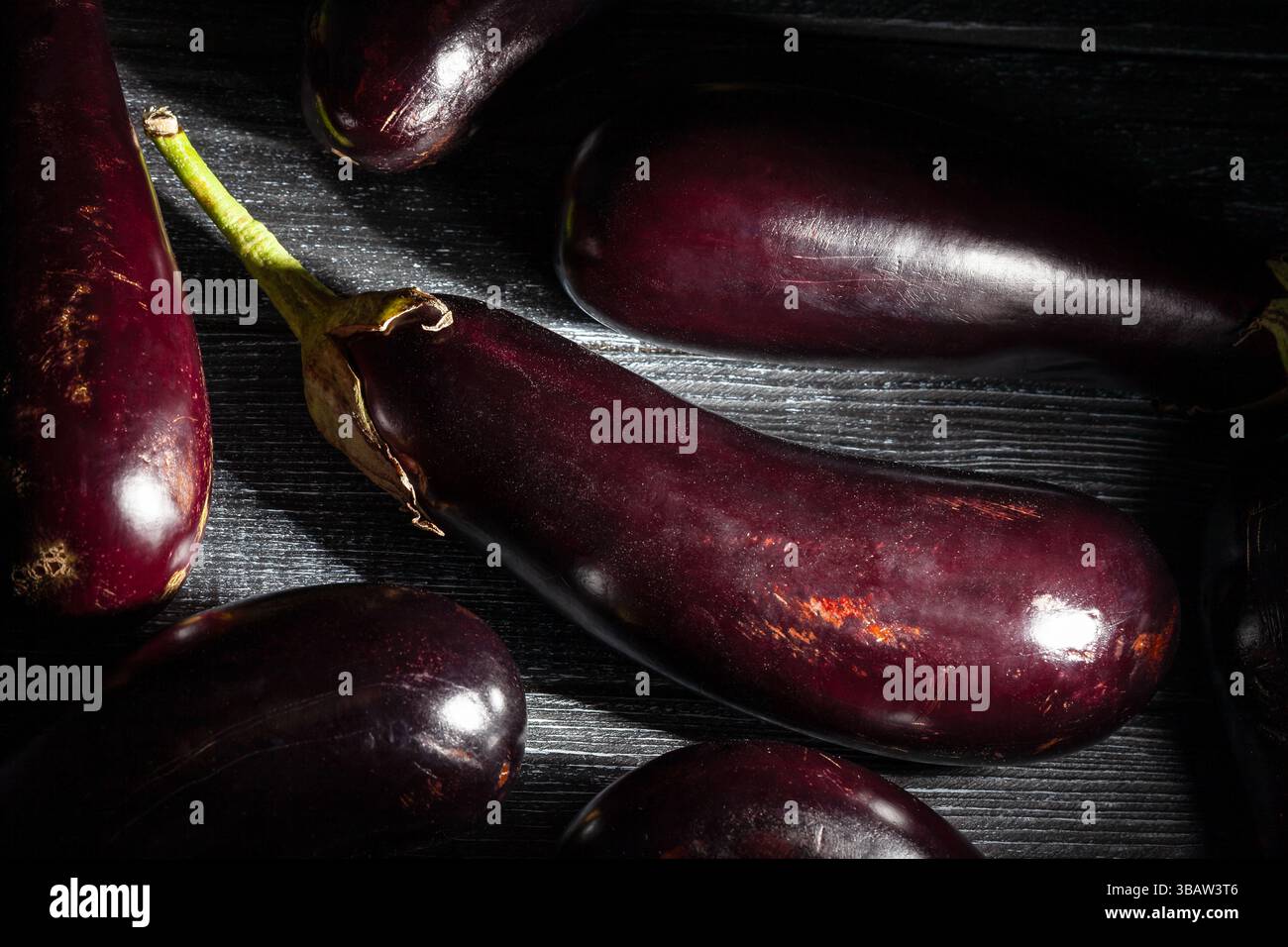 eggplant on black wood background Stock Photo