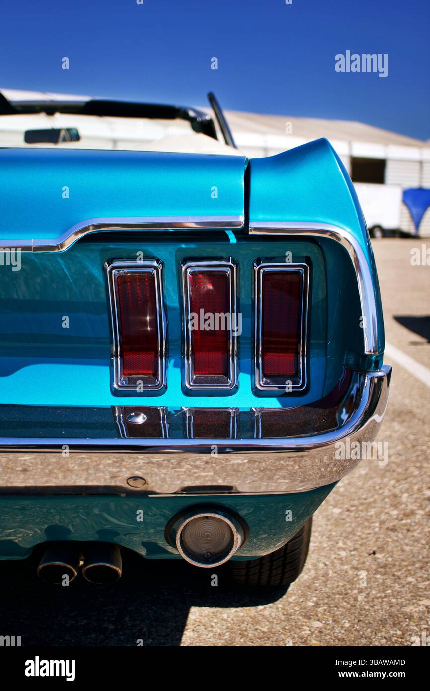 Rear View of a Classic Blue Ford Mustang Convertible with Iconic Triple ...