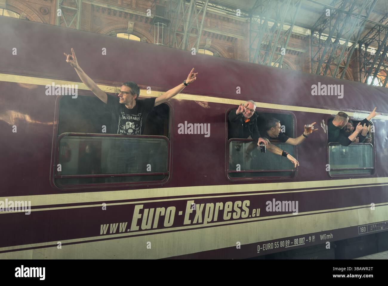 15.03.2025, Germany, Bremen, Bremen - happy heavy metal fans travelling on a special Euro-Express train to an event. 00A250315D060CAROEX.JPG [MODEL RE Stock Photo