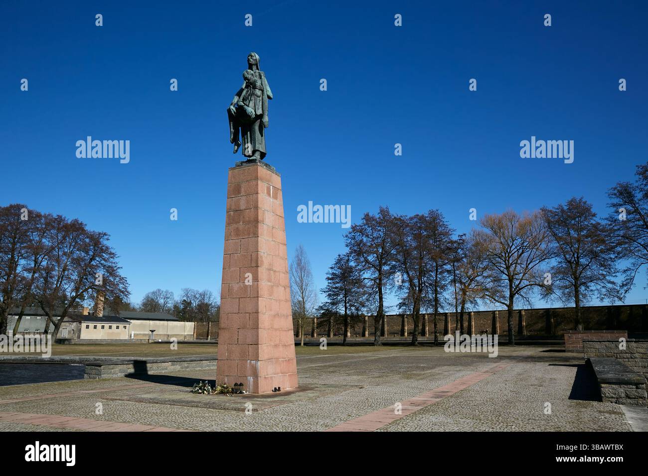 18.03.2025, Germany, Brandenburg, Fuerstenberg / Havel - The sculpture Tragende by Will Lammert on a metre-high pedestal. The artwork stands on an art Stock Photo