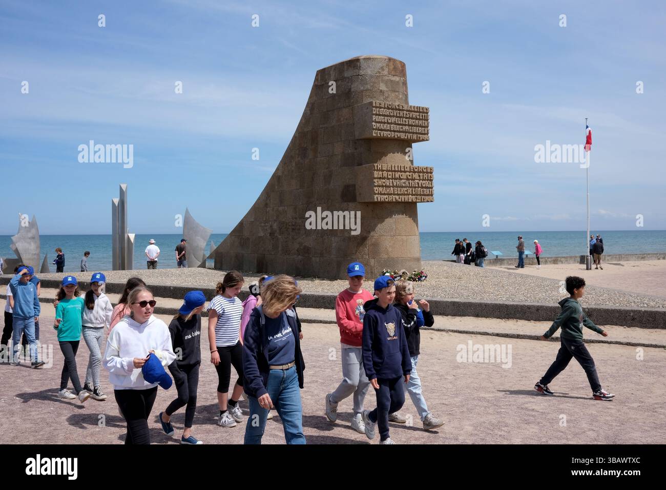 Shool students pupils at the Memorial Monument to American soldiers at Omaha Beach one of five beach landing sectors of the amphibious assault compone Stock Photo
