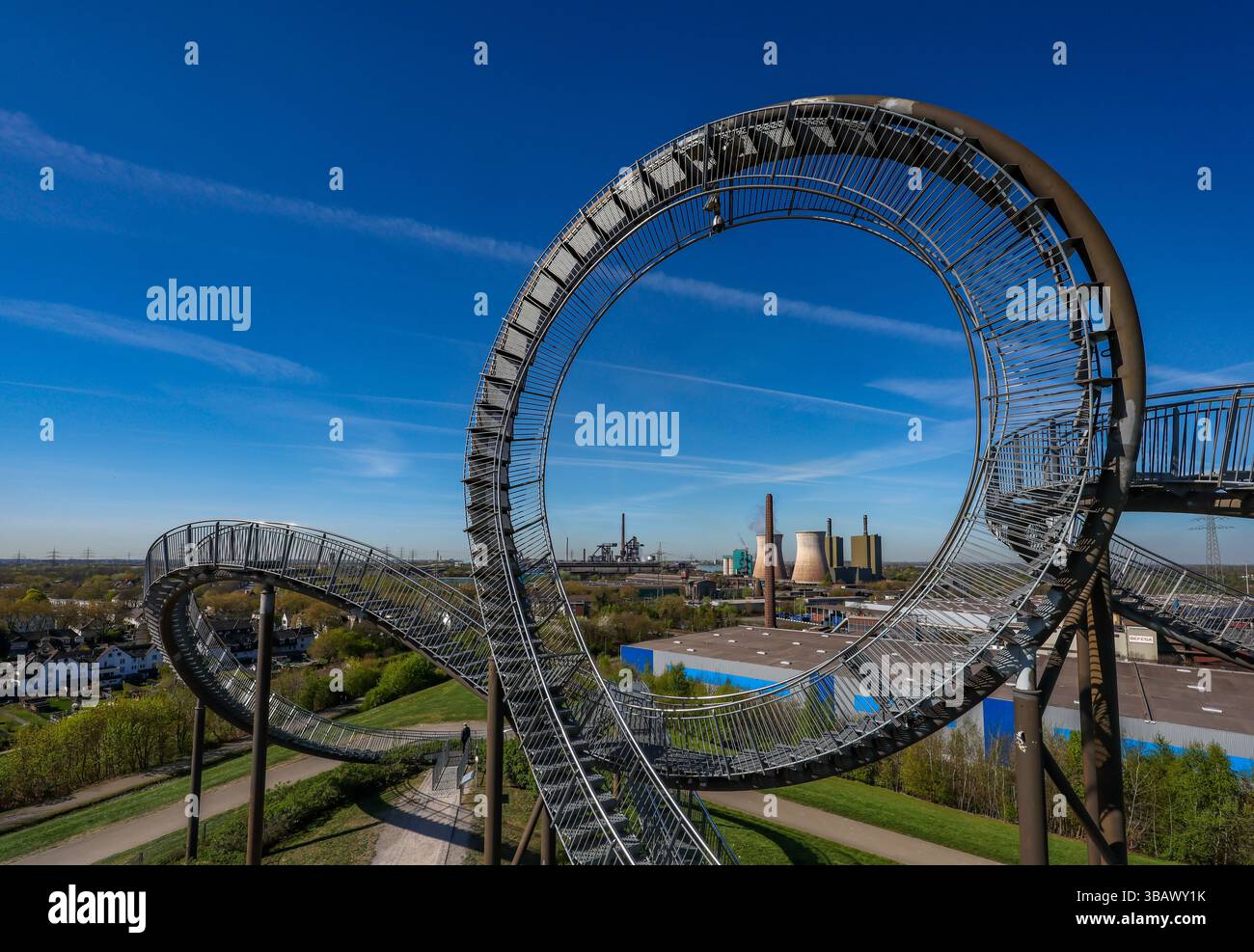 08.04.2025, Germany, North Rhine-Westphalia, Duisburg - Industrial landscape in the Ruhr area, Tiger & Turtle - Magic Mountain in front of HKM steelwo Stock Photo