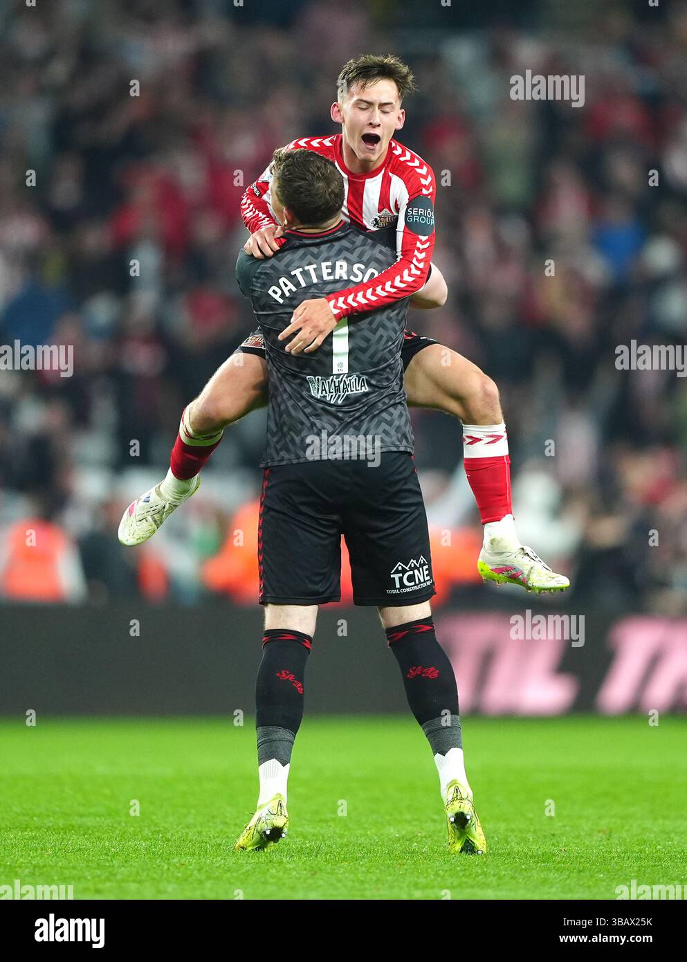 Sunderland goalkeeper Anthony Patterson (left) lifts up team-mate Chris ...