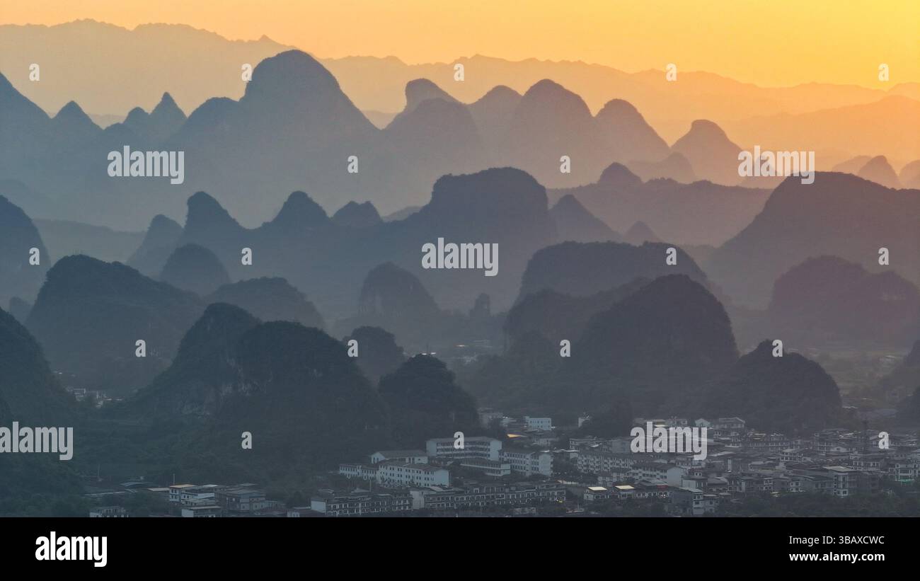 YANGSHUO, CHINA - MAY 13, 2025 - The layers of mountains (also known as ...