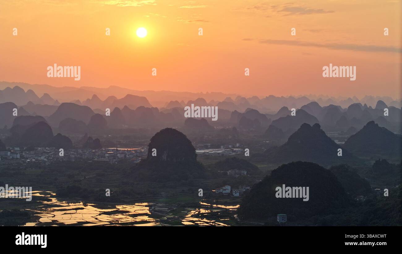 YANGSHUO, CHINA - MAY 13, 2025 - The layers of mountains (also known as ...