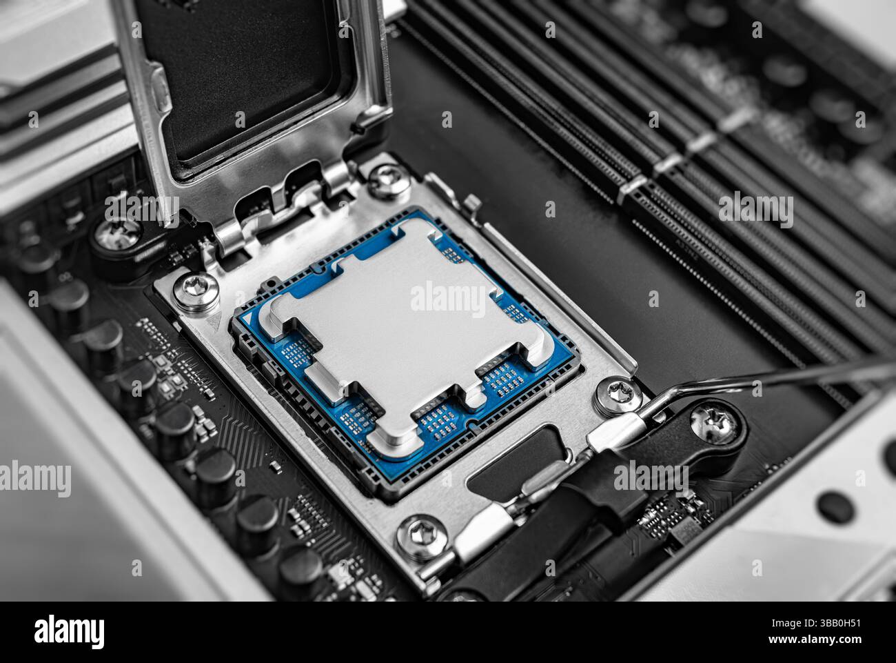 A central processing unit is securely seated in a motherboard socket Stock Photo