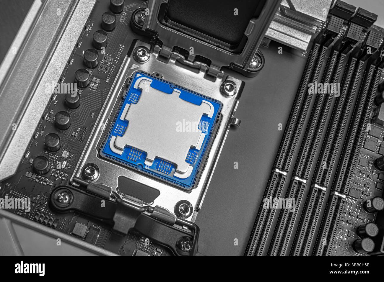 A central processing unit is securely seated in a motherboard socket Stock Photo