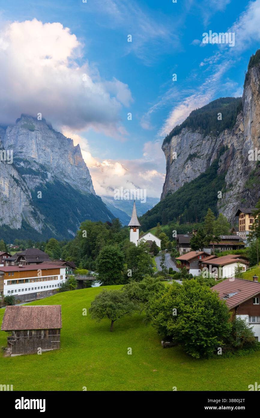 View of the small village of Lauterbrunnen at sunset in summer. Lauterbrunnen, Canton of Bern, Switzerland, Europe. Stock Photo