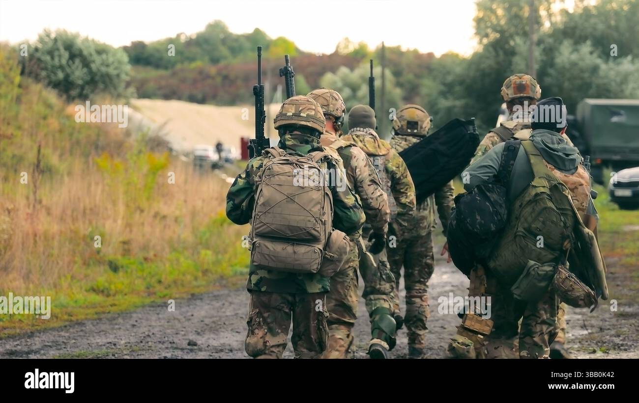 Military Squad Walking on Rural Path. Group of soldiers in camouflage ...