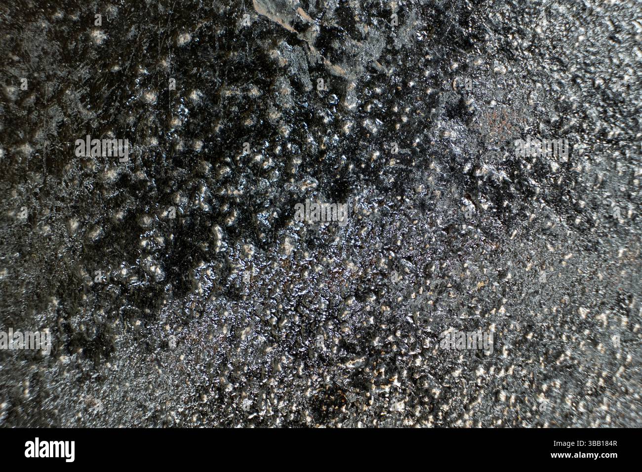 Rust stains on cast iron surface, macro Stock Photo