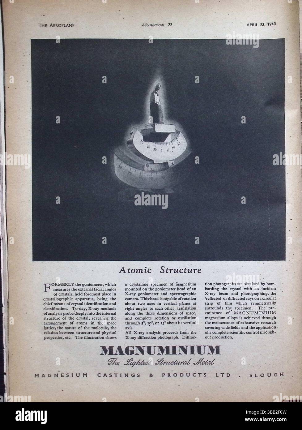 Original 1943 advertisement for Magnuminium, the lightest structural metal, featured in The Aeroplane magazine dated April 23, 1943. The ad highlights magnesium casting's role in atomic structure research and X-ray crystallography, showing advanced wartime metallurgical applications. Produced by Magnesium Castings & Products Ltd, Slough, the ad combines science and industry in a visually symbolic format of scientific instruments and rotating goniometer heads. Stock Photo