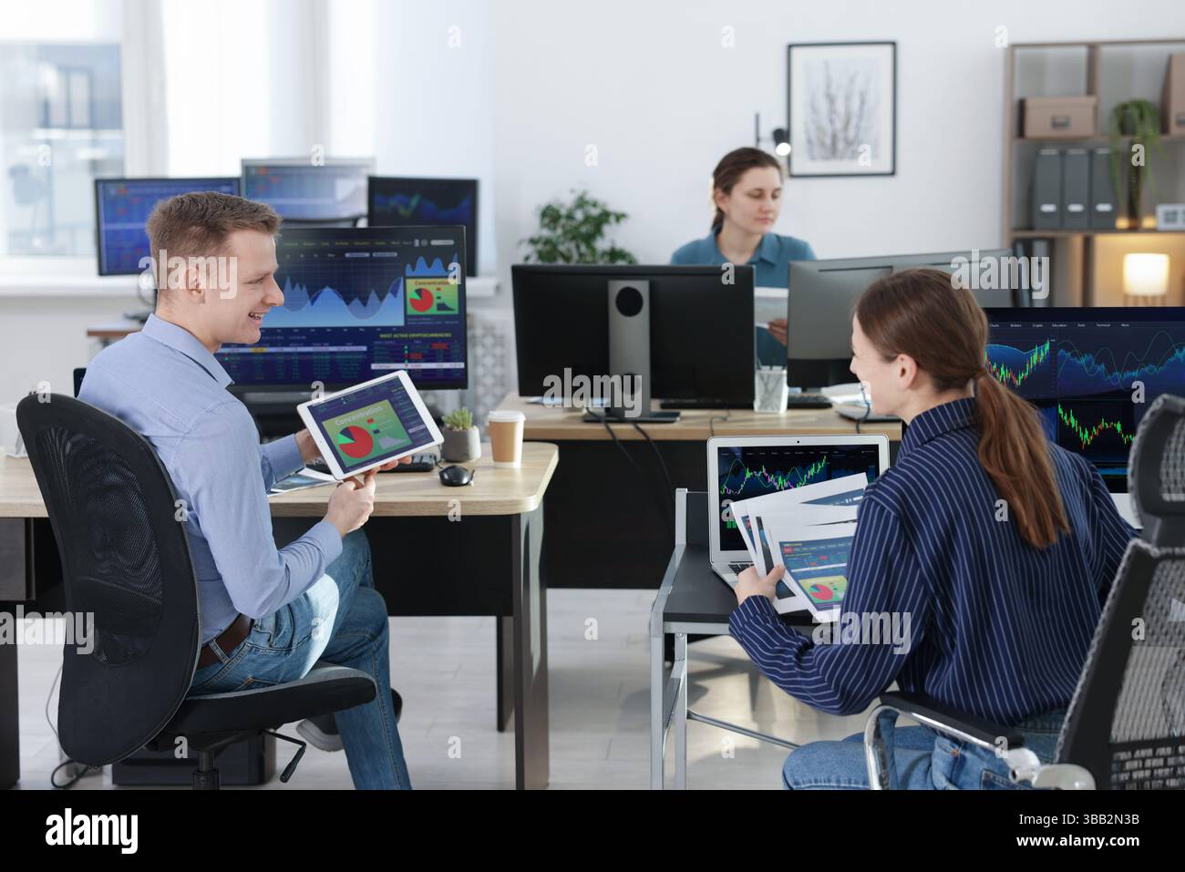 Stock exchange. Business team working together in office Stock Photo ...