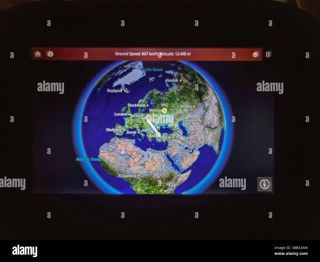 Electronic display in airplane seat, showing the big detour around Ukraine that flight from Moscow (VKO) Russia to Istanbul (IST) Türkiye has to make - Smartphone Captured Stock Image