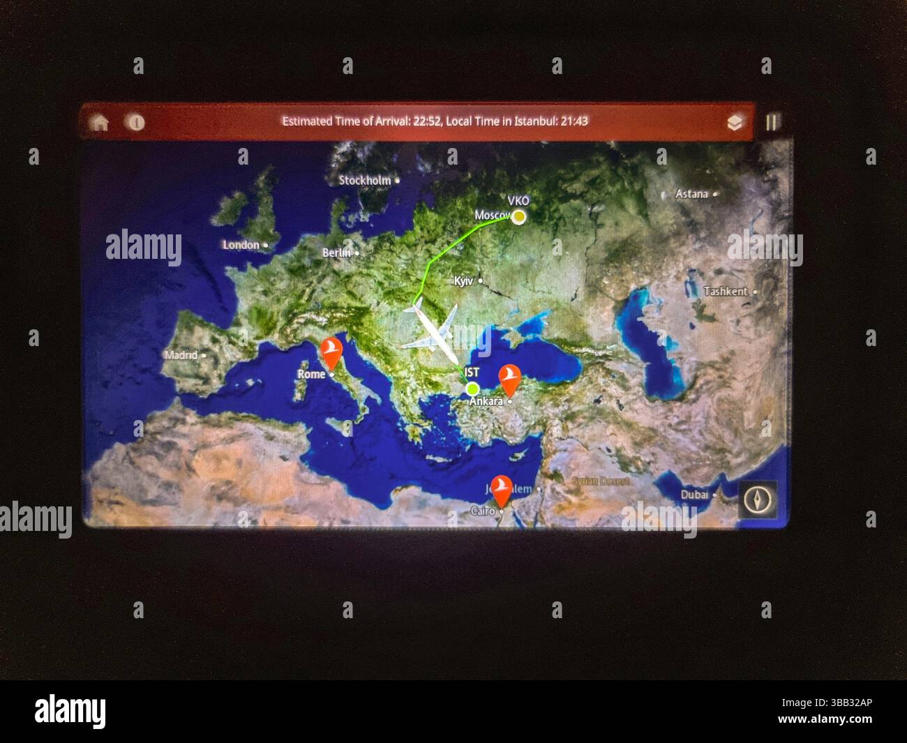 Electronic display in airplane seat, showing the big detour around Ukraine that flight from Moscow (VKO) Russia to Istanbul (IST) Türkiye has to make - Smartphone Captured Stock Image