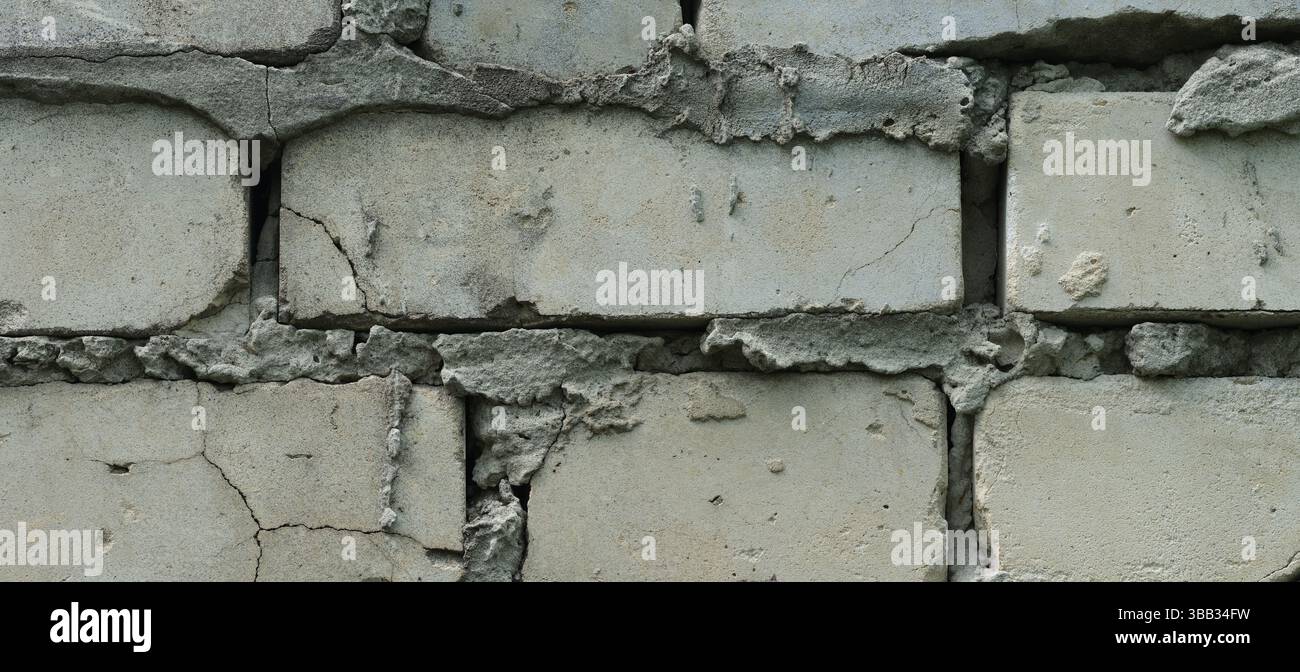 An old shabby red brick wall background. Close up. Stock Photo