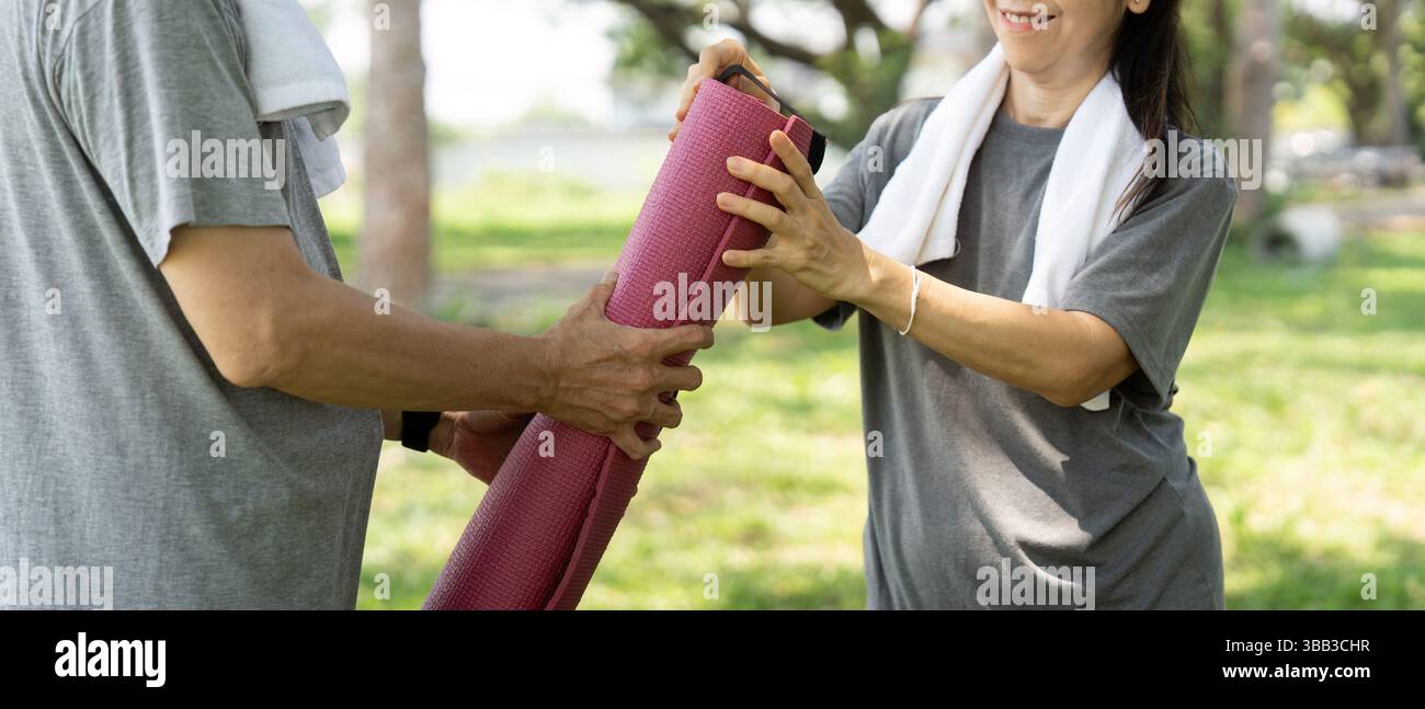 Wellness and yoga routines shared by active seniors couple Stock Photo ...